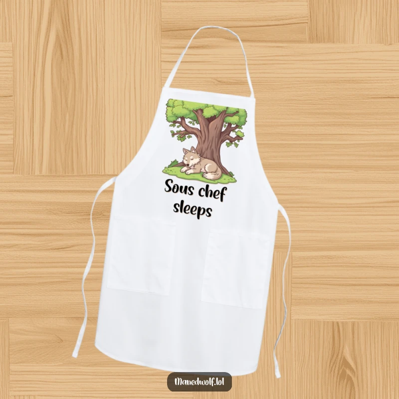 Funny maned wolf apron showing a content maned wolf resting peacefully under the shade of a large tree.