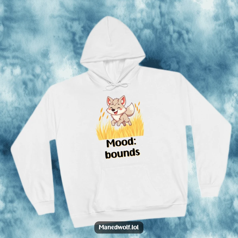 Funny maned wolf hoodie showing a joyful wolf bounding through tall golden grass, radiating happiness.