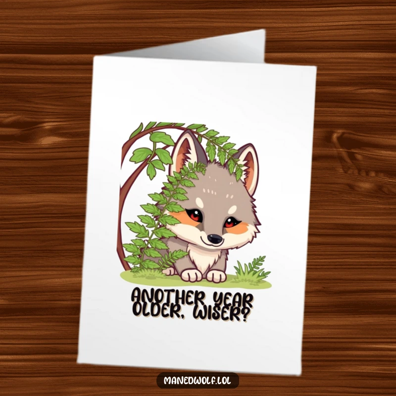 Funny Free Printable Birthday Card: Chubby maned wolf peeking out from under a lush fern, with wide, curious eyes and a sweet expression.